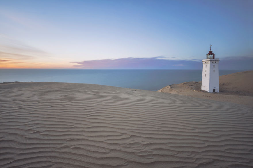 lighthouse on sand dunes